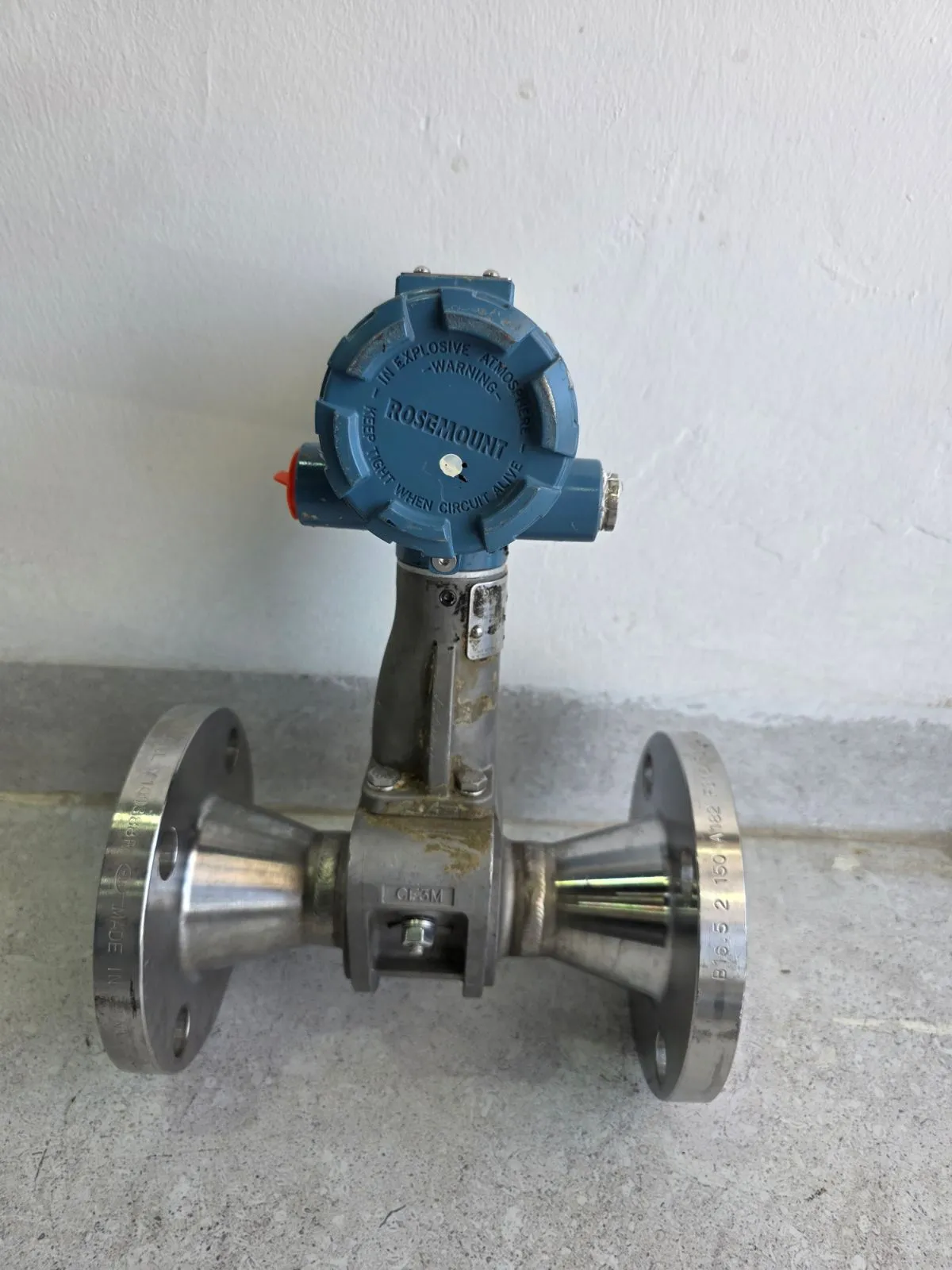 Front view showing the blue Rosemount explosion-proof cover, CF3M reducer body and two 2" Class 150 flanges