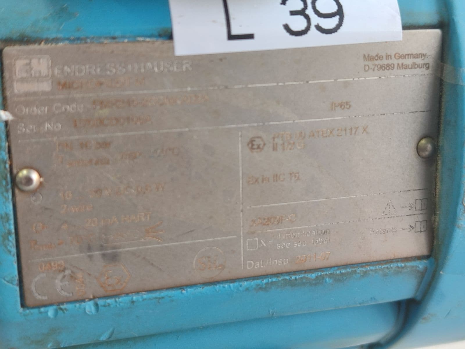 Endress+Hauser Micropilot M FMR245 radar level transmitter — nameplate, photographed in Barmaan's warehouse