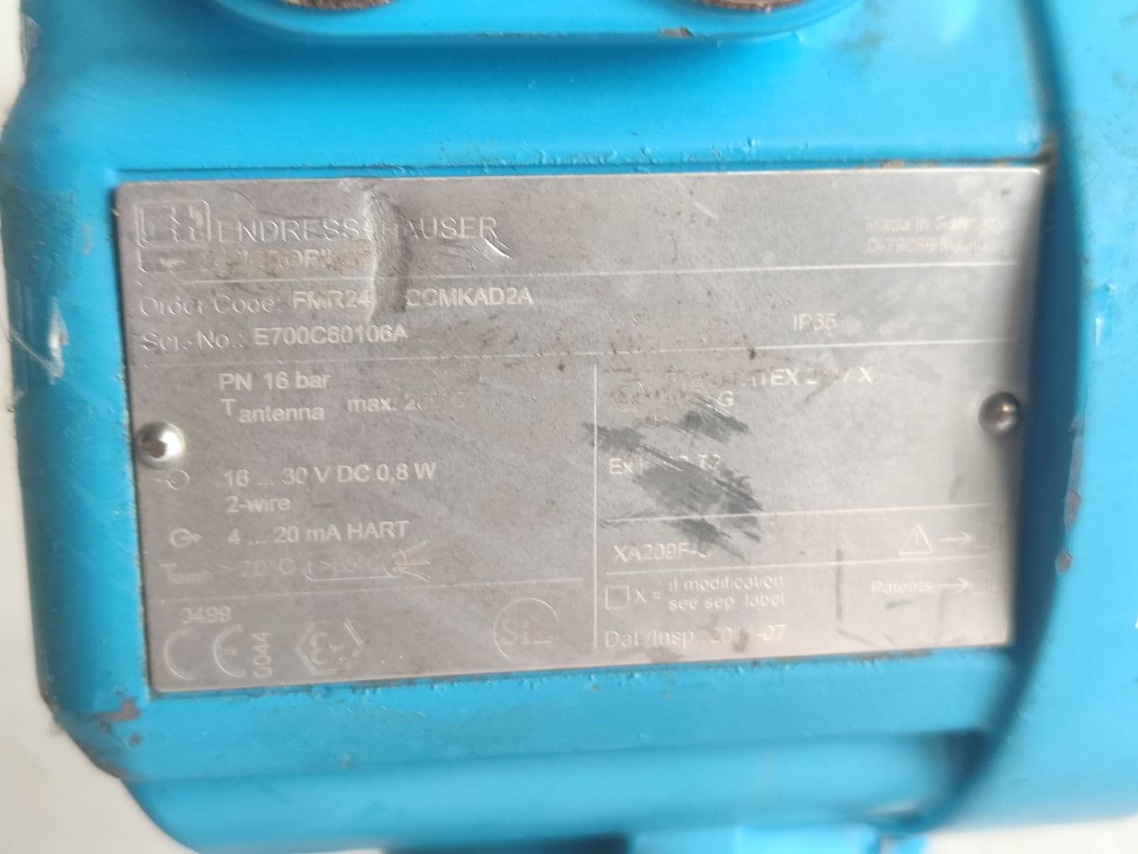 Endress+Hauser Micropilot M FMR245 radar level transmitter — nameplate, photographed in Barmaan's warehouse