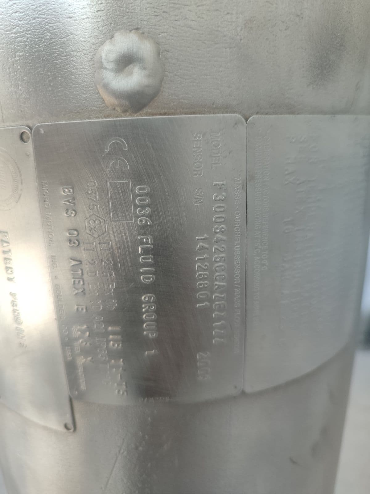 Sensor nameplate of the oldest meter — model code, fluid group 1, Ex ib IIB, certificate BVS 03 ATEX E 176 X